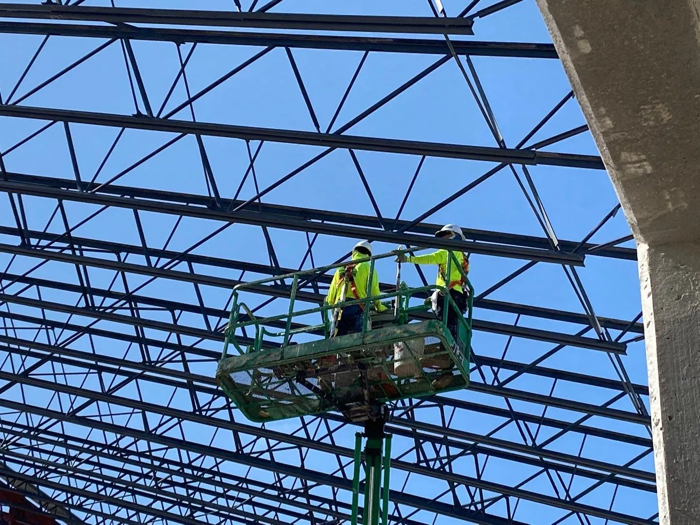 MTD crew on a lift under the steel roof structure at Great Wolf Naples