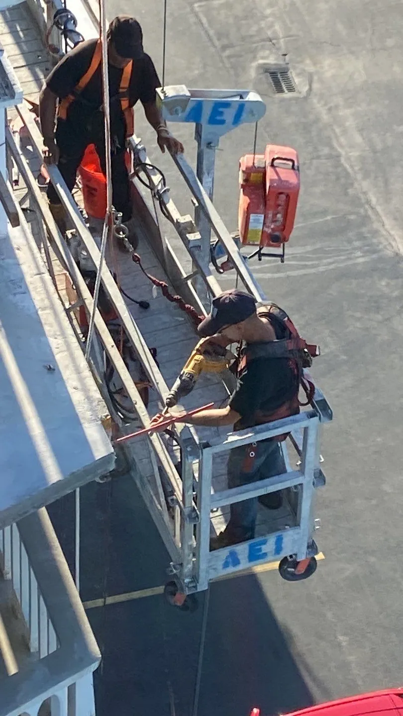 MTD crew on a swing stage at Hallandale Towers