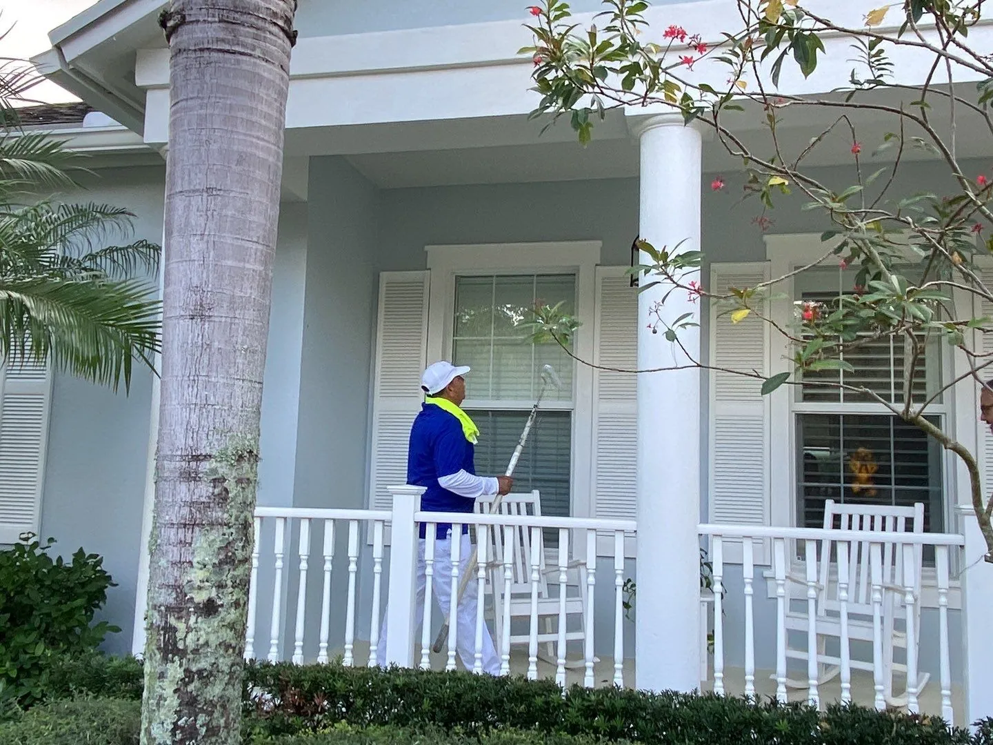 MTD painter working on a porch at Mallory Creek