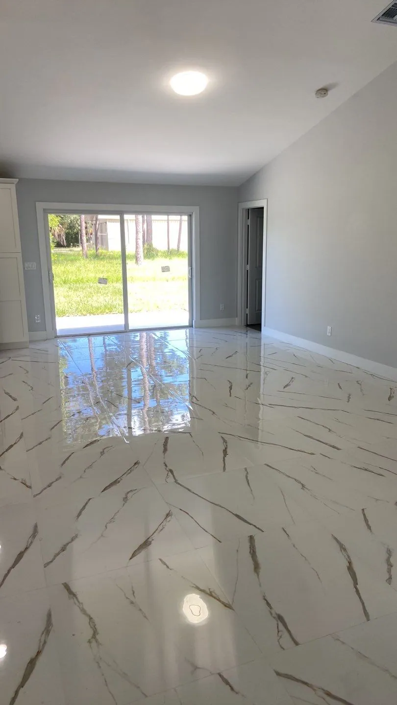 Living area with marble-look floors in the Bradbury home